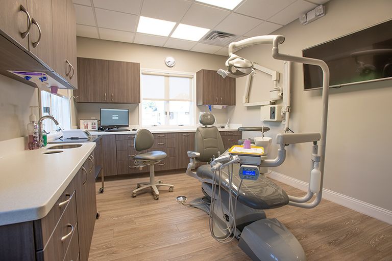 Exam room with dental chair and equipment